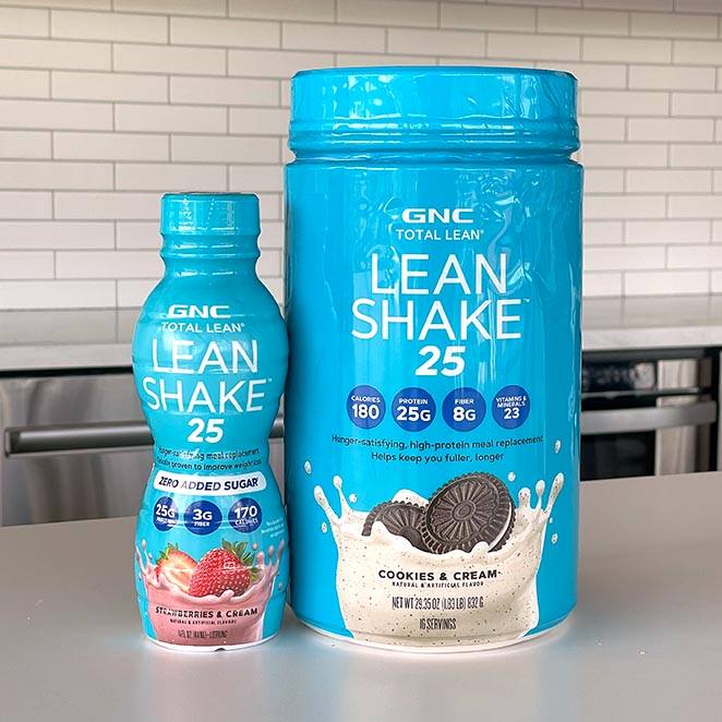 Teal bottle and teal tub of TotalLean Shake 25 on counter.