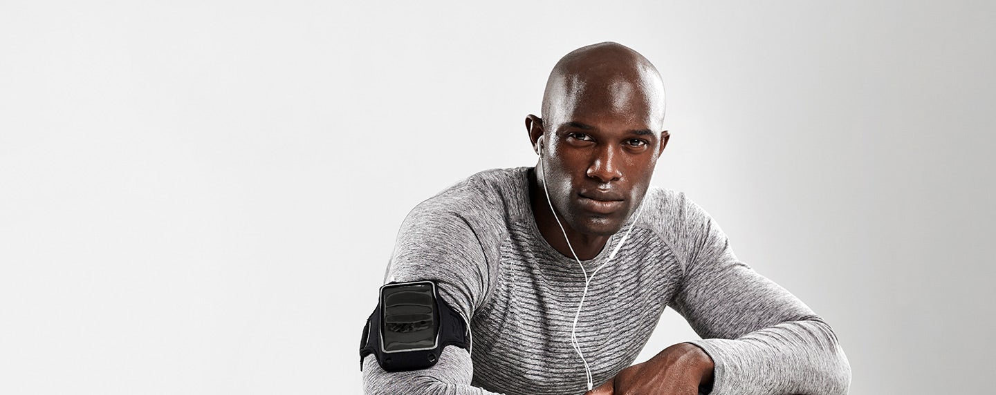 Man Crouching Down in Workout Gear