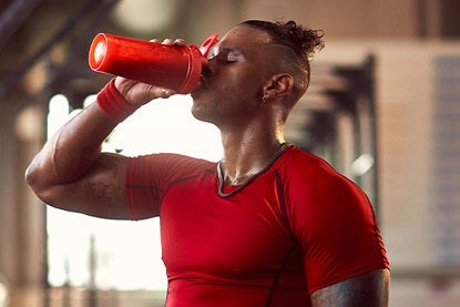 Man drinking from shaker bottle