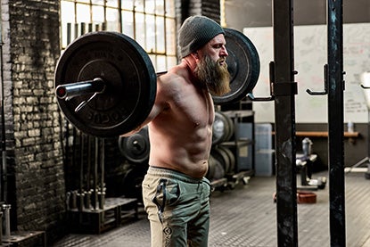 Man Barbell Back Squatting