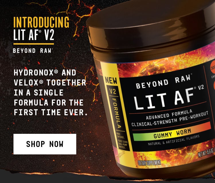 Promotional graphic featuring a tub of Beyond Raw LIT AF V2 pre-workout (Gummy Worm flavor) against a dark, fiery background. Text reads: &lsquo;Introducing LIT AF V2,&rsquo; &lsquo;HydroNOX and VeloX together in a single formula for the first time ever,&rsquo; and a &lsquo;Shop Now&rsquo; button.
